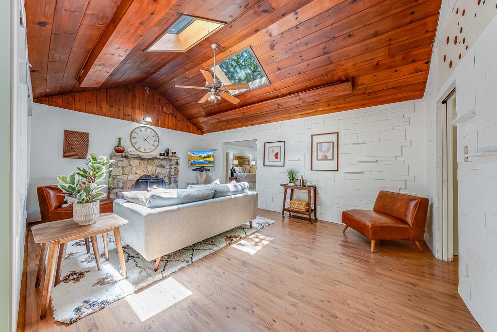 168 Riverside Drive Boulder Creek, CA 95006 - Photo 5 of 52 a living room with furniture and a wooden floor