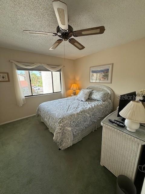 1648 Stickney Point Road, Unit 48202 Sarasota, FL 34231 - Photo 11 of 18 a bedroom with a bed and window