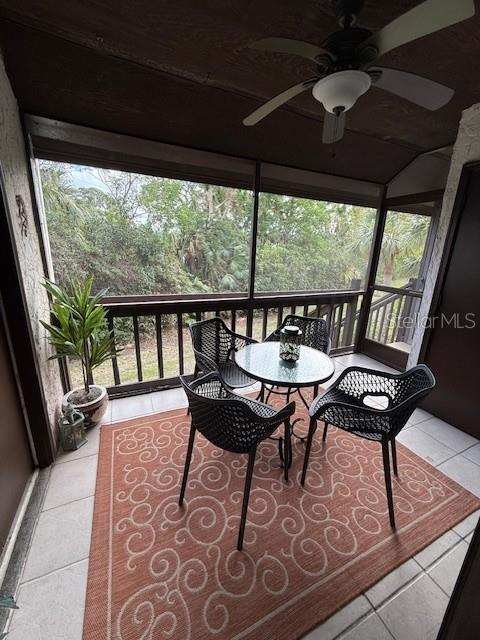 1648 Stickney Point Road, Unit 48202 Sarasota, FL 34231 - Photo 14 of 18 a view of a dining room with furniture window and outside view