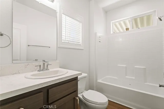 an aerial view of a large building with a mountain