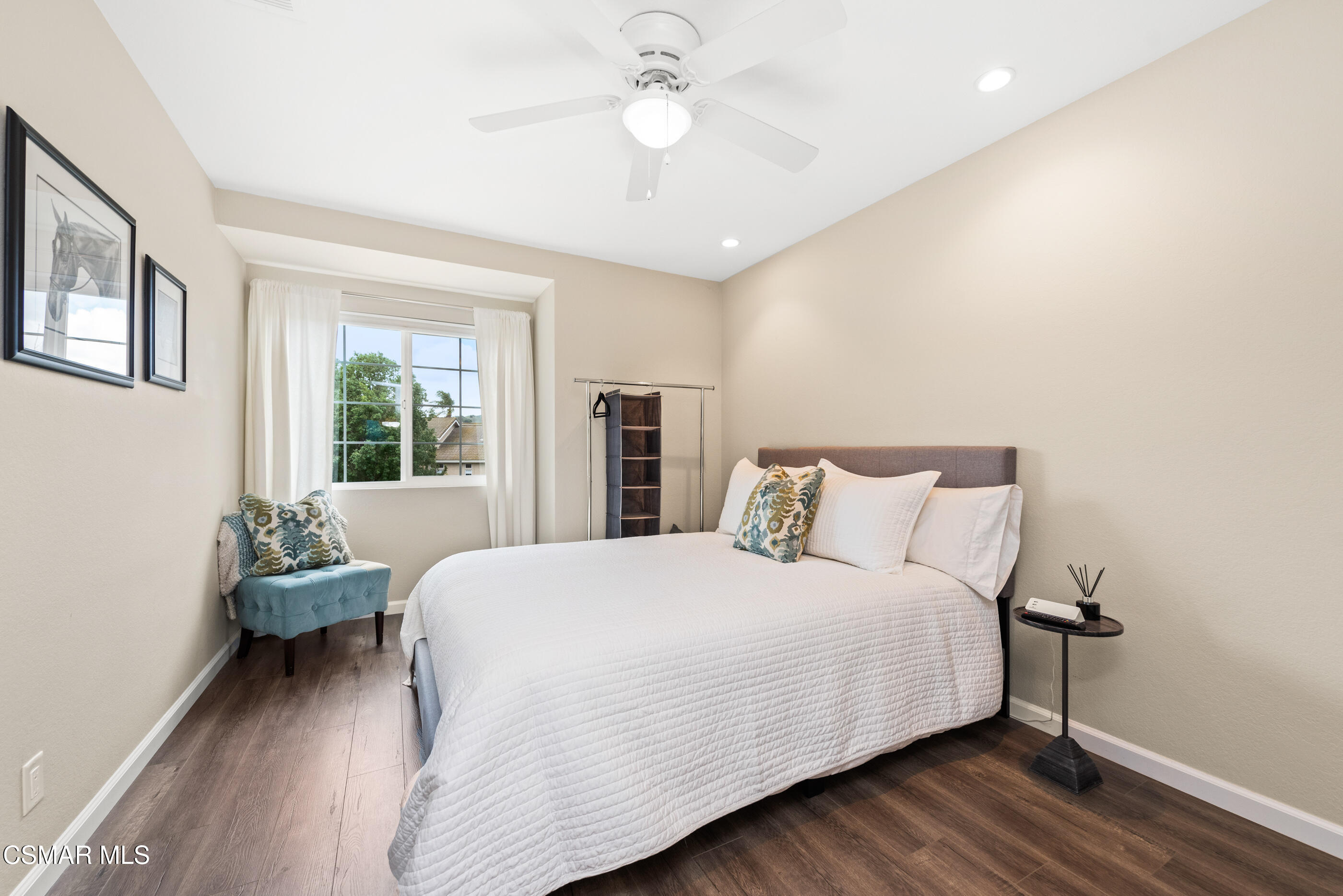 575 Fairfield Road Simi Valley, CA 93065 - Photo 30 of 57 a bedroom with a bed and a chandelier