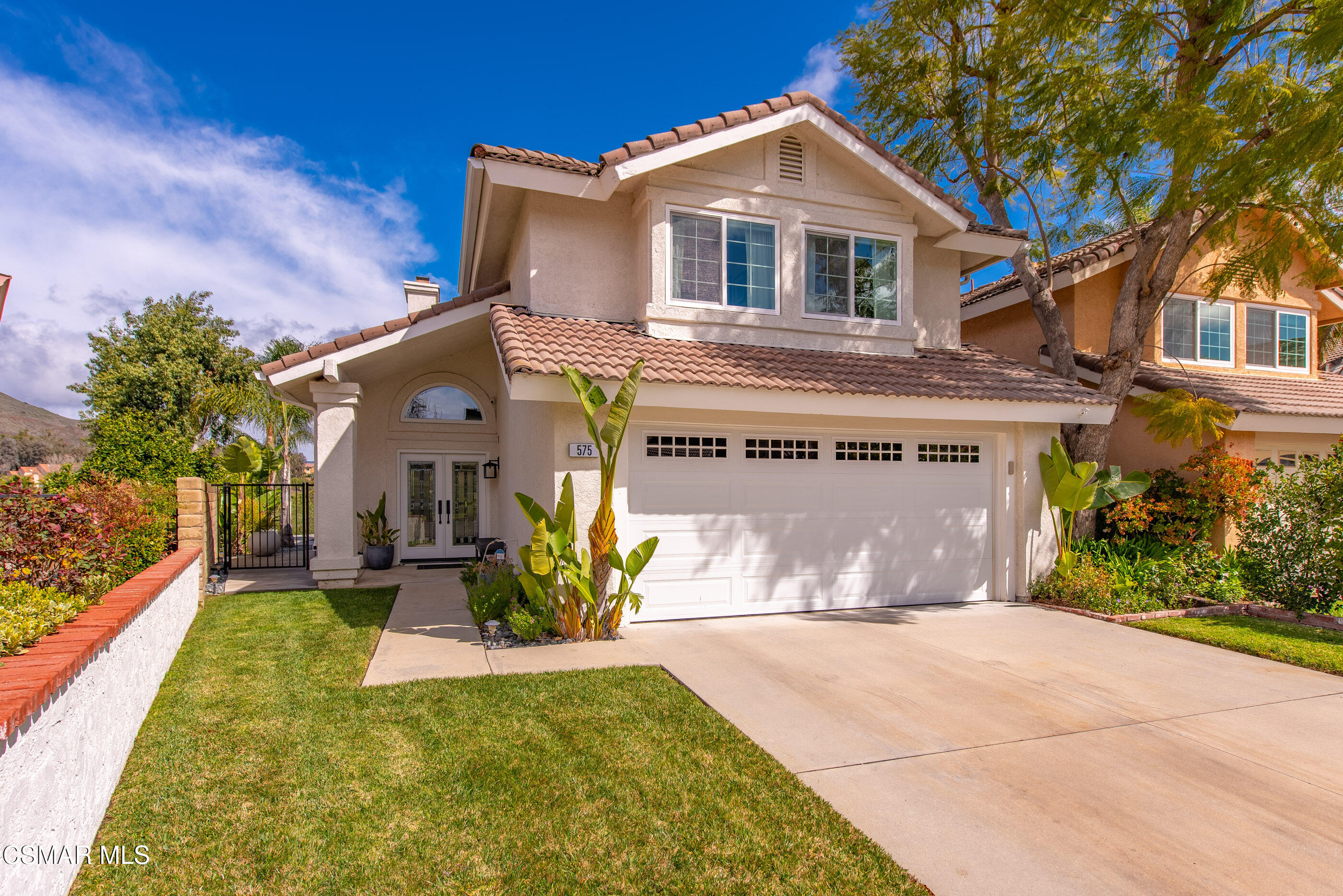 575 Fairfield Road Simi Valley, CA 93065 - Photo 7 of 57 a front view of a house with a yard and garage