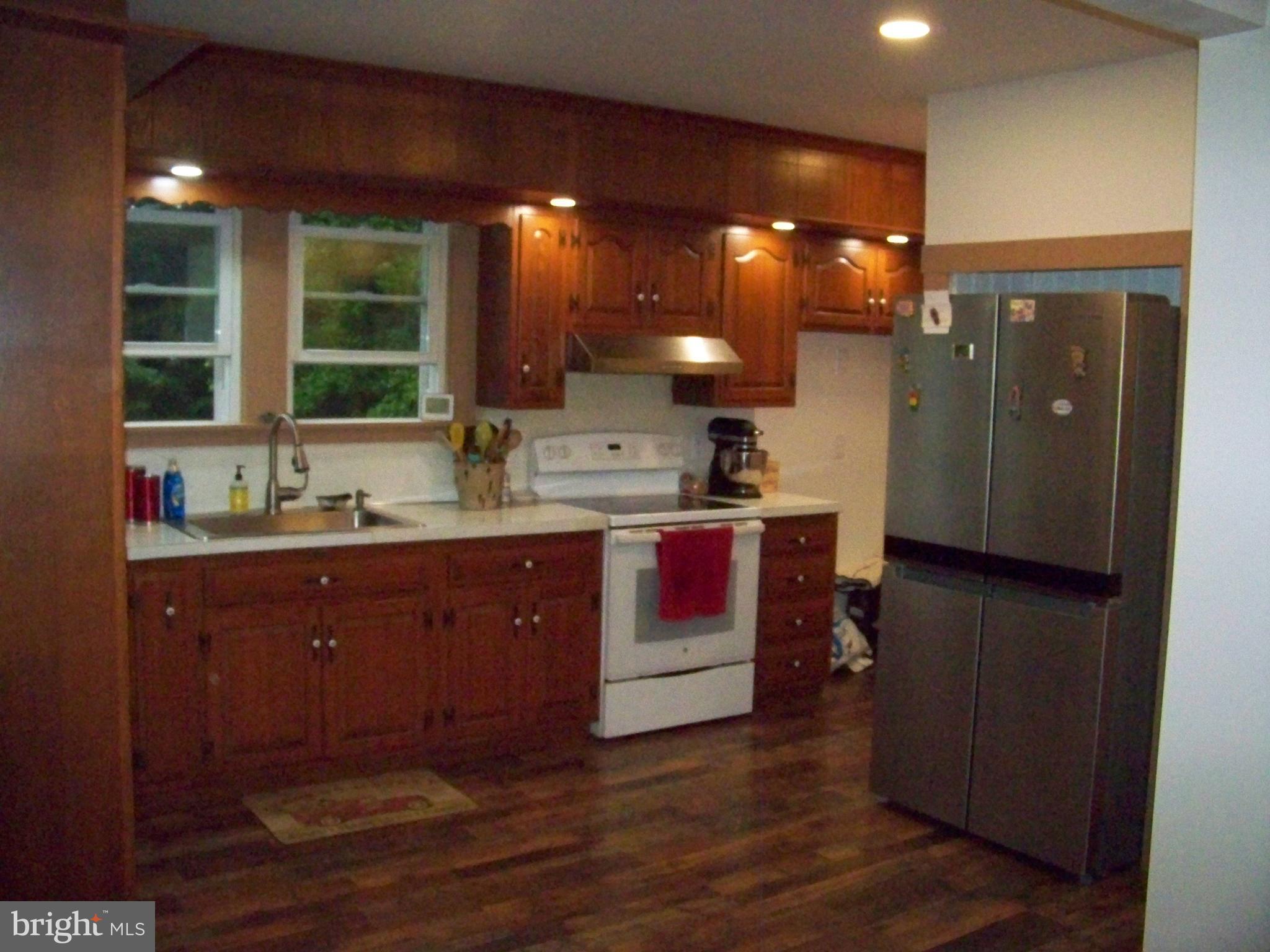 362 Buck Road Quarryville, PA 17566 - Photo 9 of 21 a kitchen with a sink and a wooden cabinets