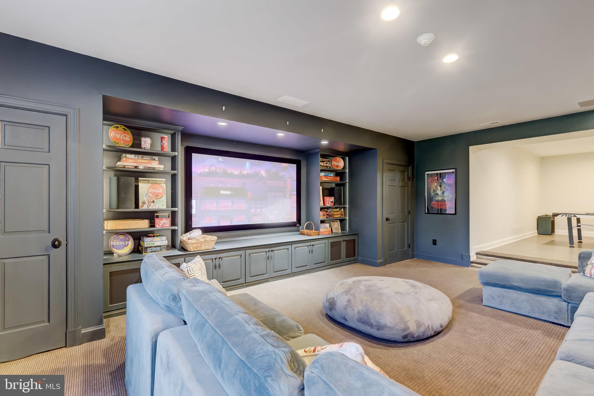 7305 Brightside Road Baltimore, MD 21212 - Photo 77 of 96 Projector and movie screen with surround sound