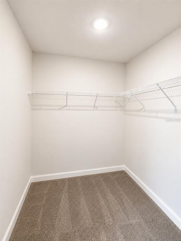 5892 Southwest 82nd Lane Ocala, FL 34476 - Photo 9 of 24 a view of a room with racks on the wall
