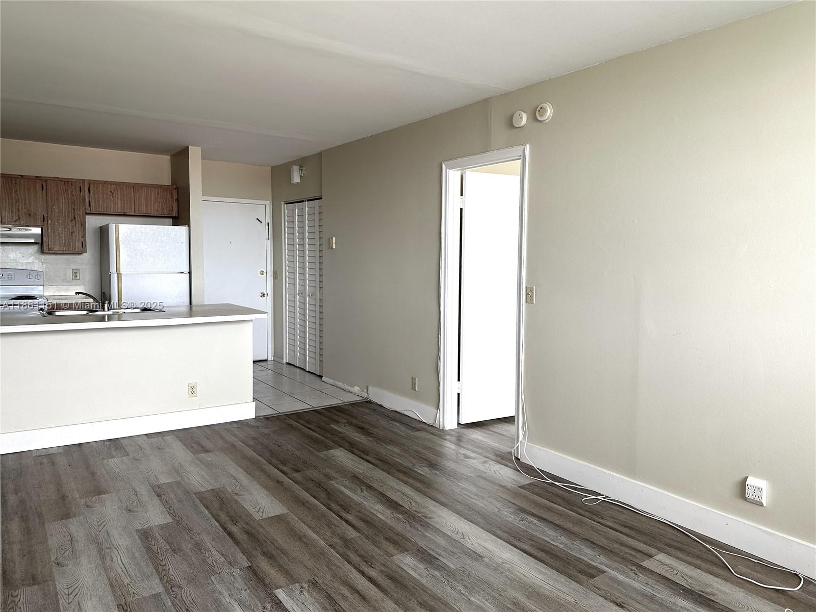 2501 Riverside Drive, Unit 506A Coral Springs, FL 33065 - Photo 5 of 15 a view of kitchen with wooden floor