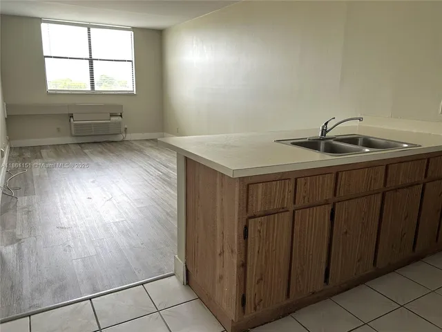 a bathroom with a sink and a window