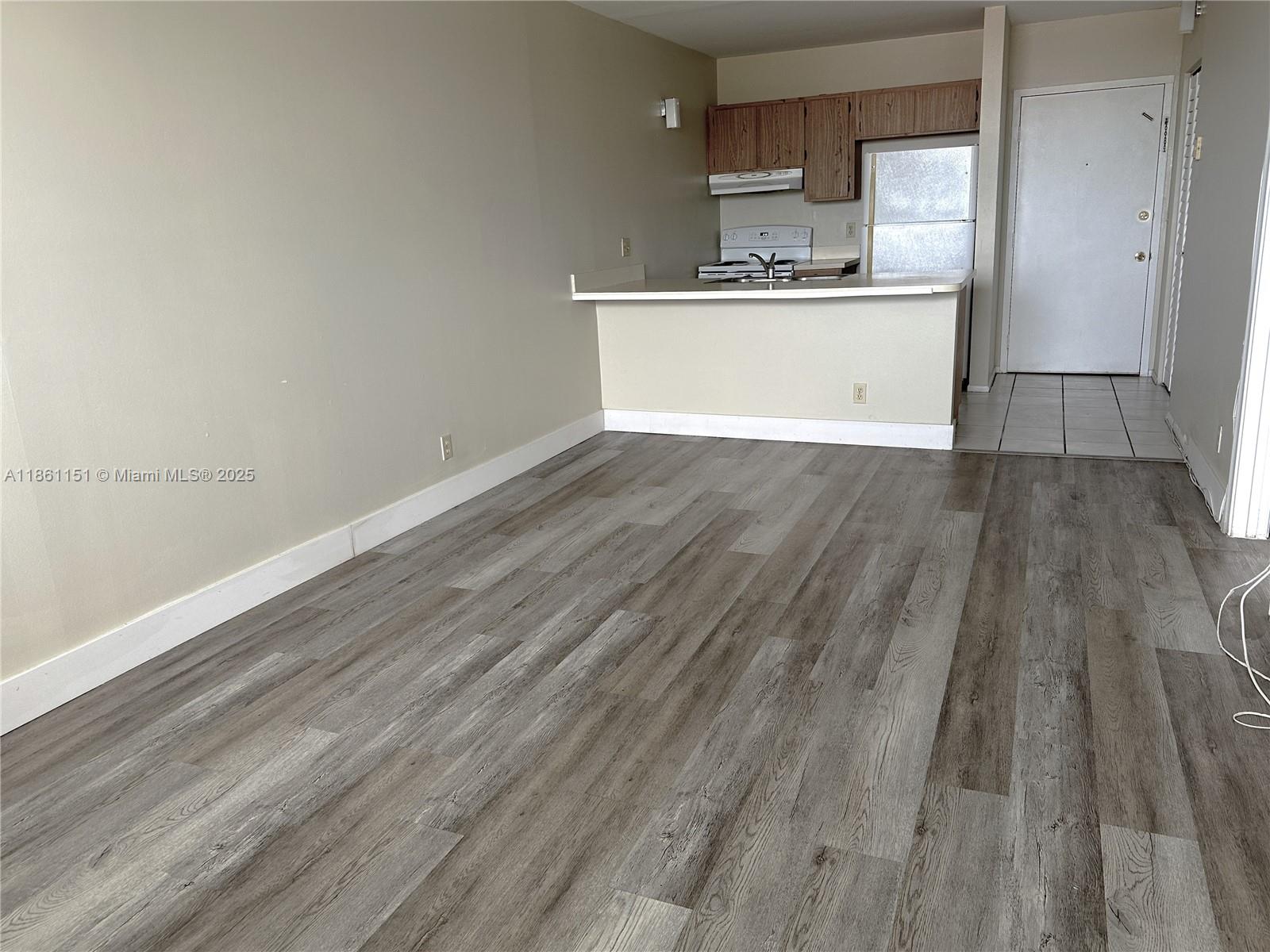 2501 Riverside Drive, Unit 506A Coral Springs, FL 33065 - Photo 8 of 15 a view of kitchen with wooden floor