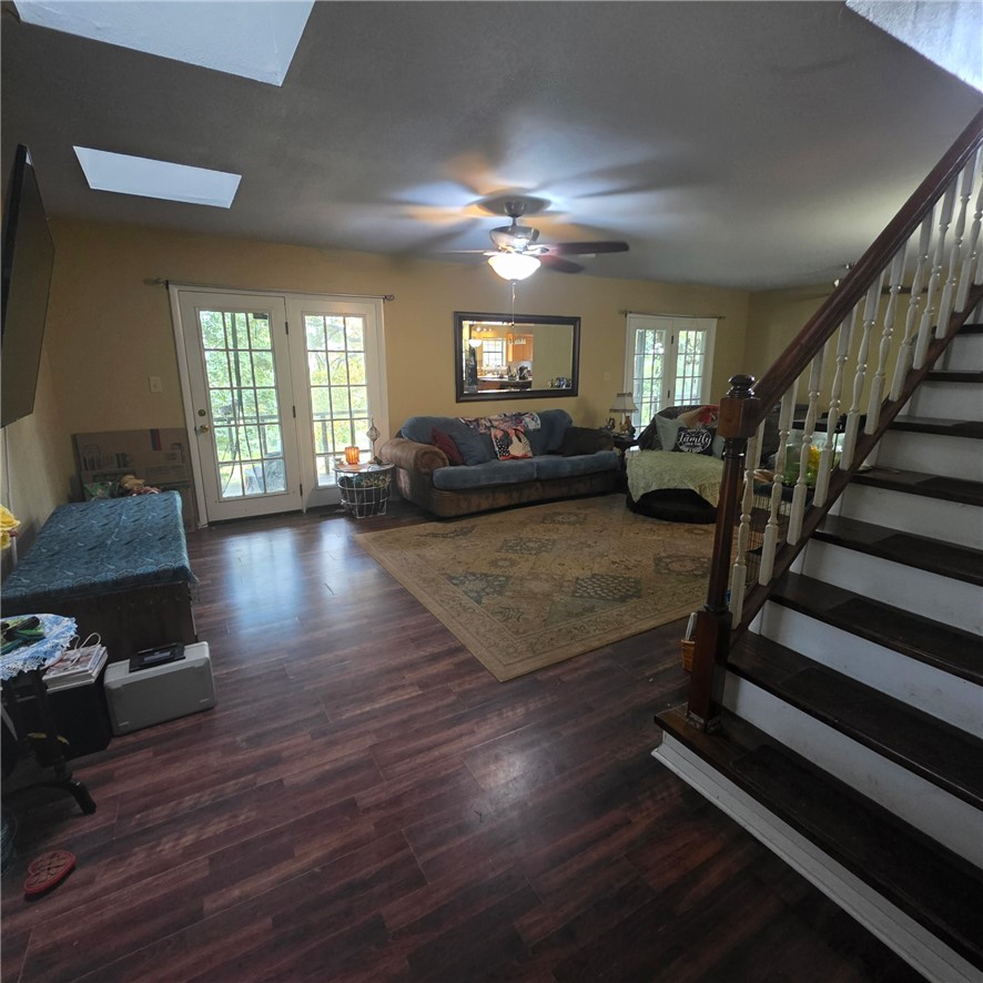 1014 Excelsior Road Greenwood, AR 72936 - Photo 18 of 37 Open living area featuring rich wood-finish flooring