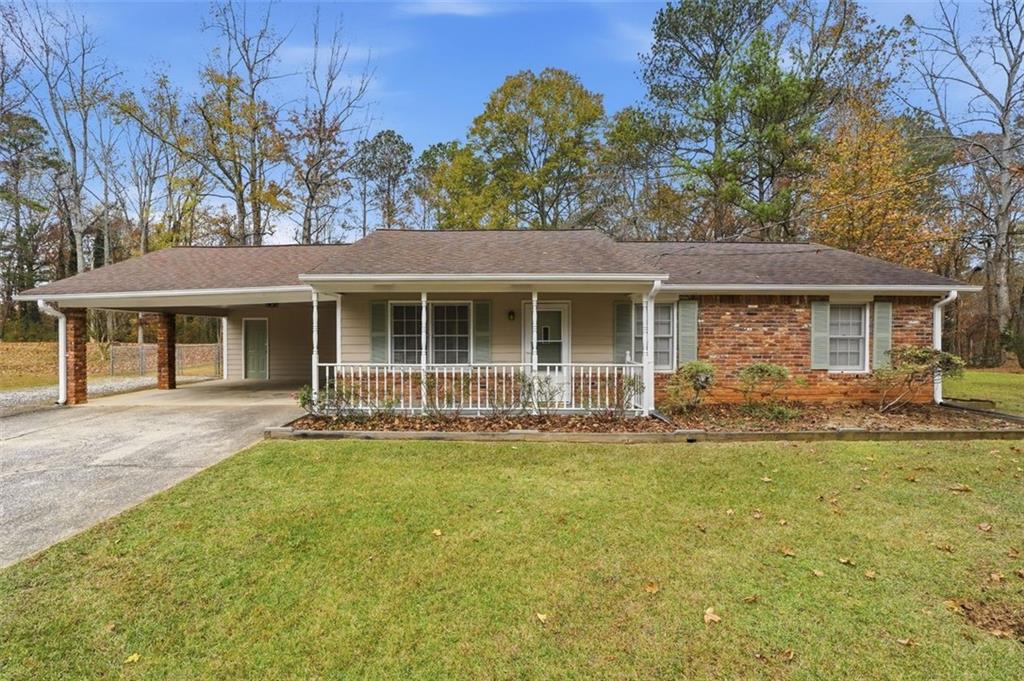 4079 Anneewakee Road Douglasville, GA 30135 - Photo 1 of 1 front view of a house with a yard