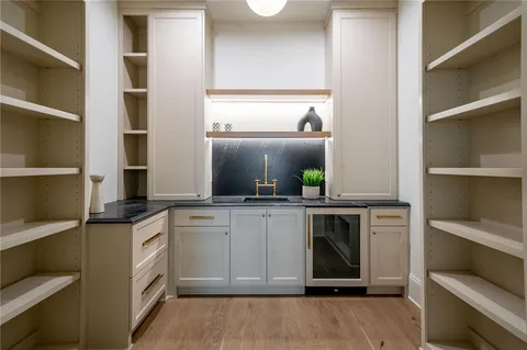 a kitchen with cabinets and window