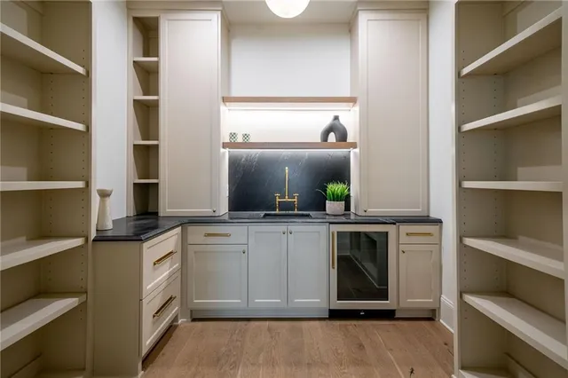 a kitchen with cabinets and window