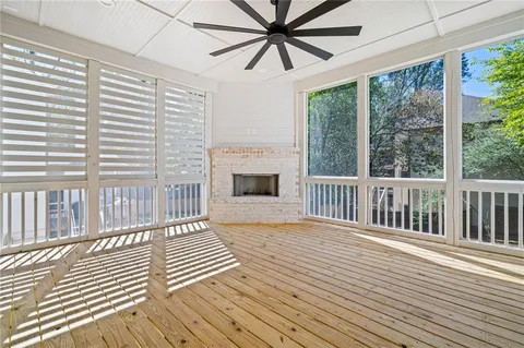 a view of a porch with wooden floor and outdoor space