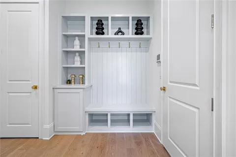 a view of kitchen with wooden floor and shelf