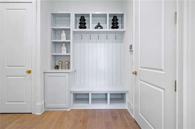 a view of kitchen with wooden floor and shelf