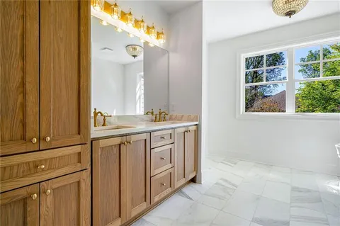a bathroom with a sink a vanity and a mirror