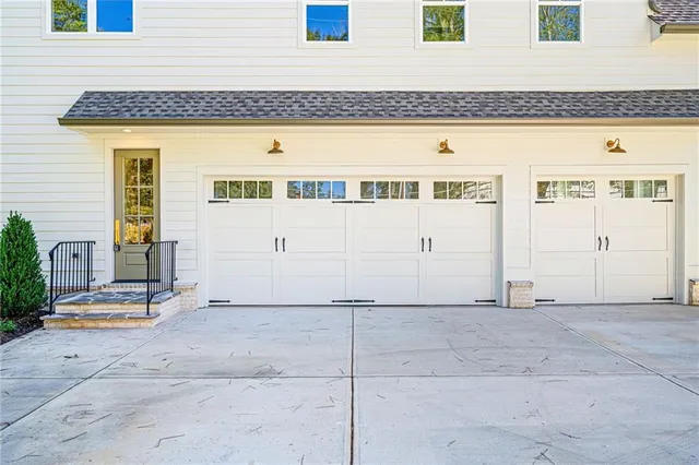 a view of a house with potted plants