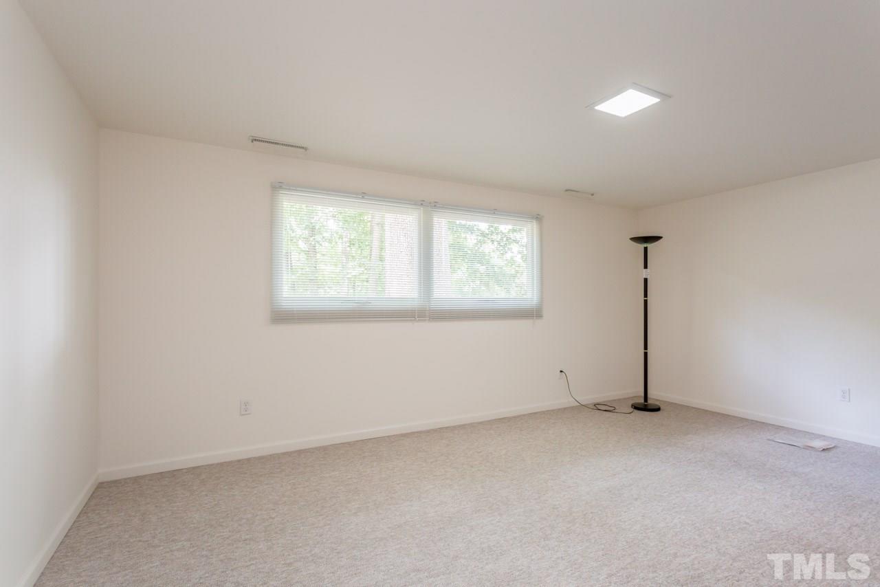 3900 Donna Road Raleigh, NC 27604 - Photo 15 of 25 an empty room with windows