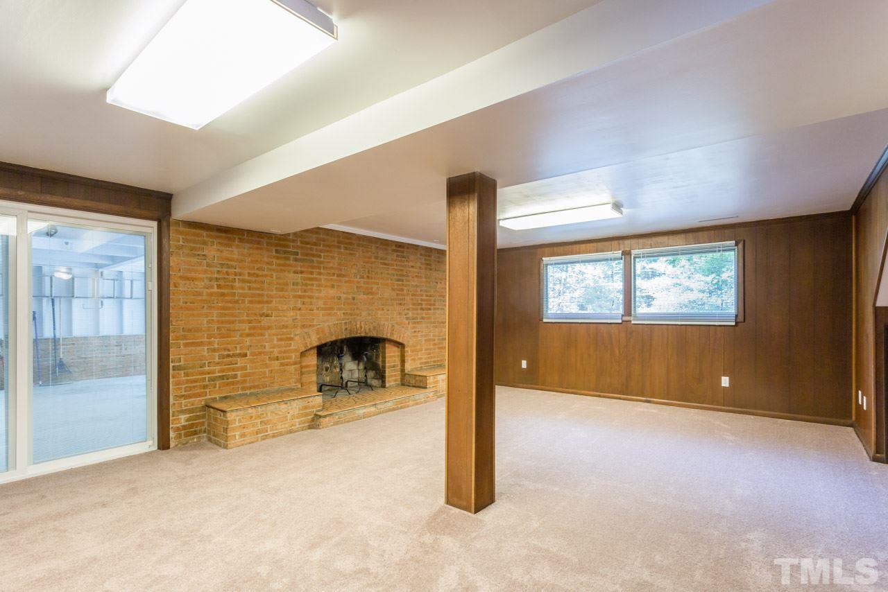 3900 Donna Road Raleigh, NC 27604 - Photo 17 of 25 a view of a livingroom with a fireplace