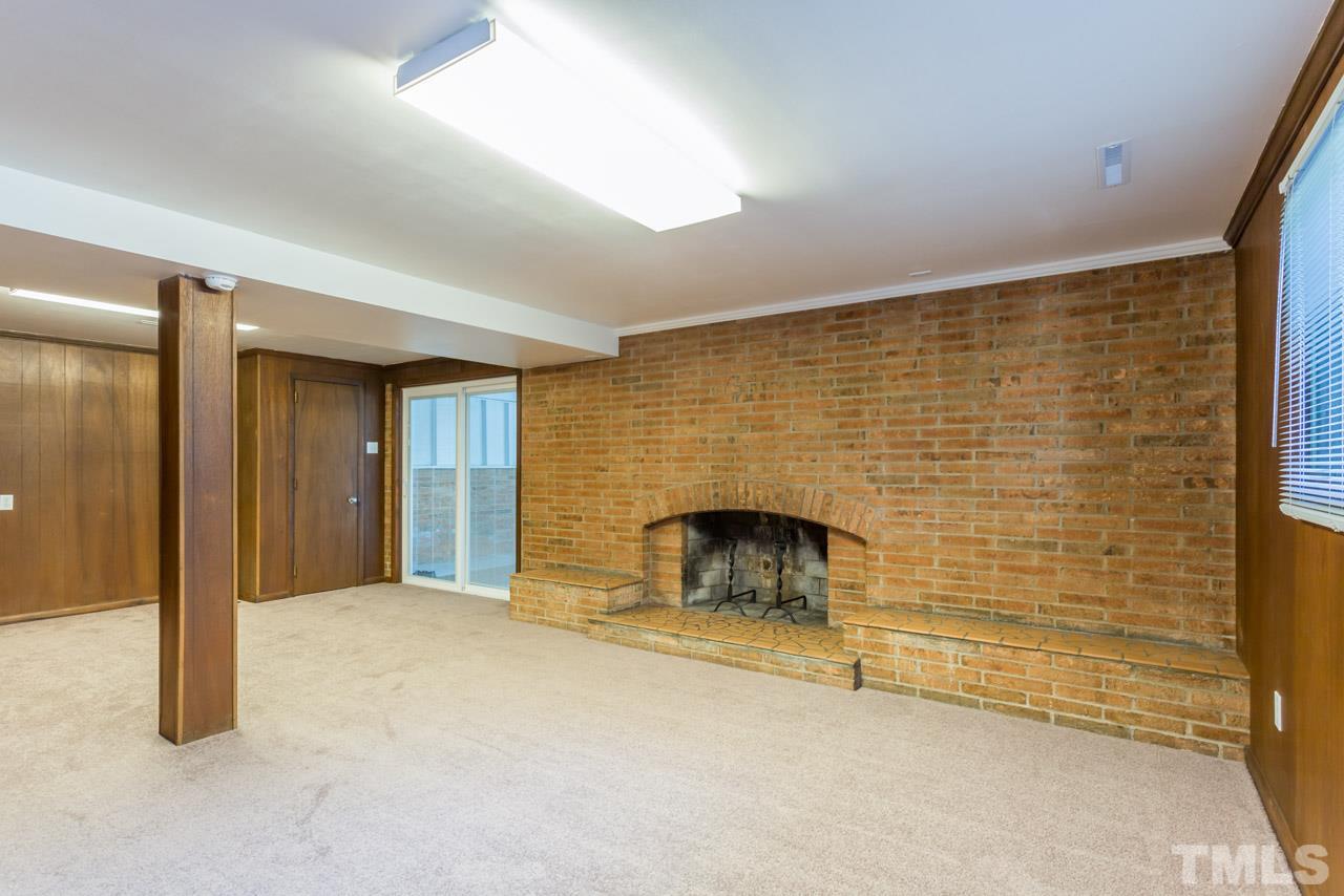 3900 Donna Road Raleigh, NC 27604 - Photo 19 of 25 a view of an empty room with a fireplace