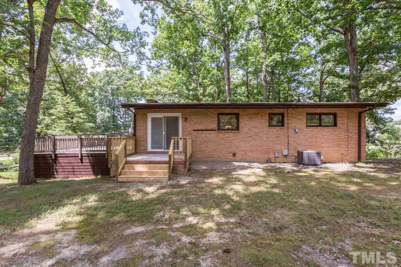 3900 Donna Road Raleigh, NC 27604 - Photo 24 of 25 a backyard of a house with table and chairs