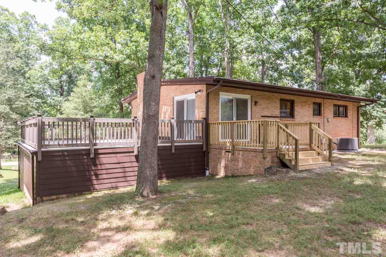 3900 Donna Road Raleigh, NC 27604 - Photo 25 of 25 a view of a house with a yard and wooden fence