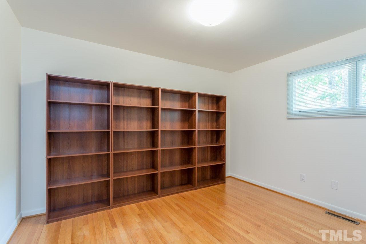 3900 Donna Road Raleigh, NC 27604 - Photo 9 of 25 a view of an empty room with empty shelves