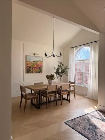 a dining room with furniture and window