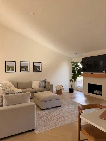 a room with round mirror and cabinets