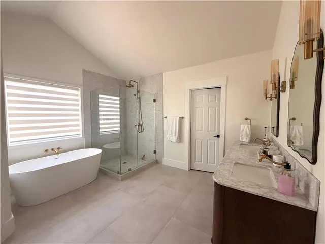 a bed room with a bed and a large window