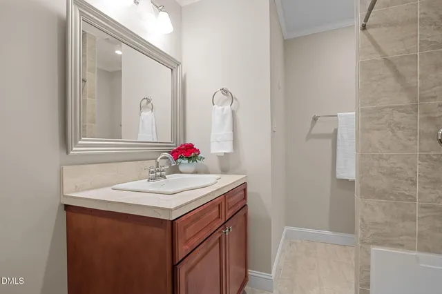 a bathroom with a sink and a mirror