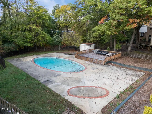 a view of a swimming pool with a patio