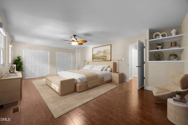 a spacious bedroom with a large bed and a couch