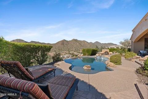 a view of a patio in the backyard
