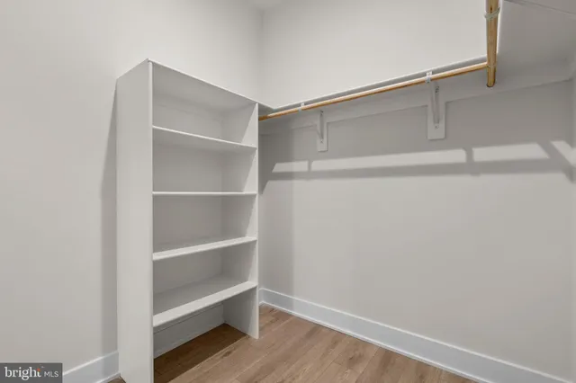 a view of an empty walk in closet