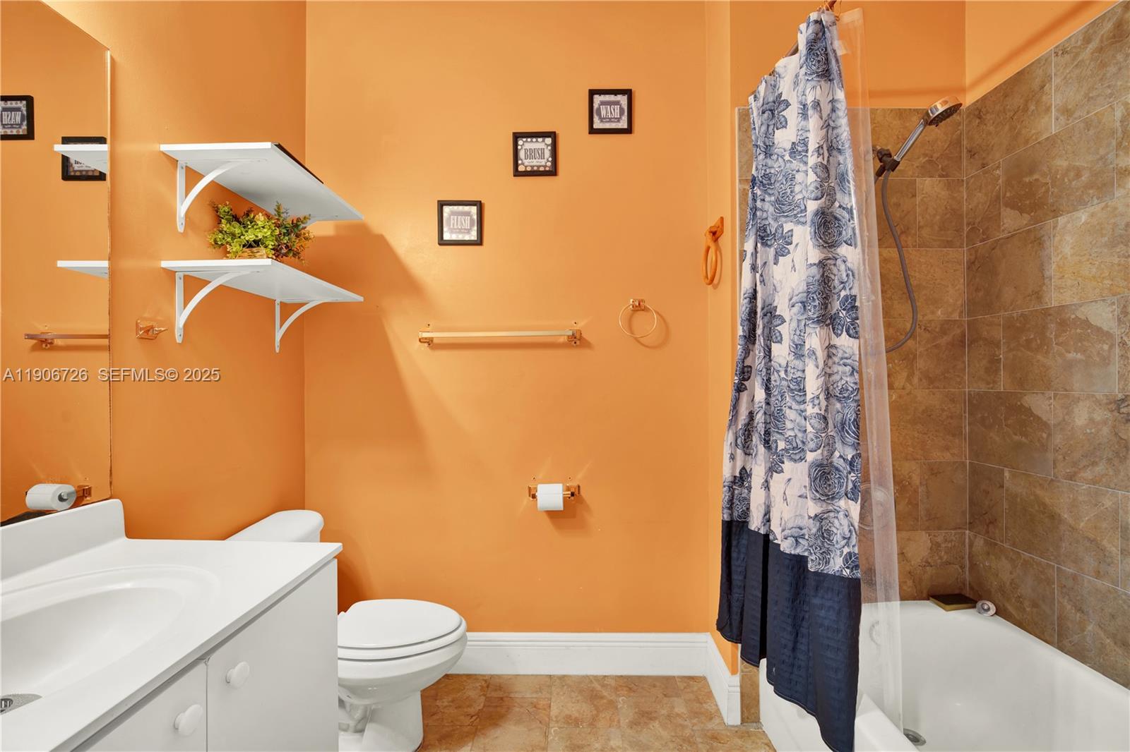 10973 Southwest 238th Street Homestead, FL 33032 - Photo 13 of 25 a bathroom with a toilet and a shower