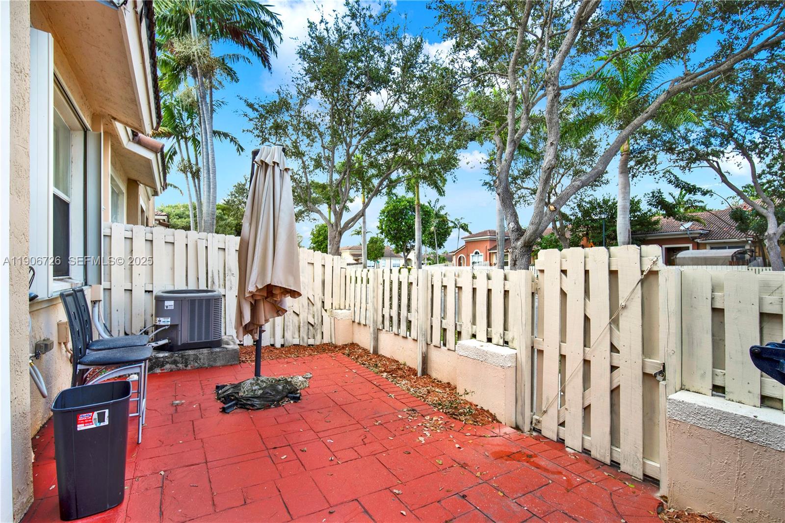 10973 Southwest 238th Street Homestead, FL 33032 - Photo 22 of 25 a view of a house with wooden fence and floor