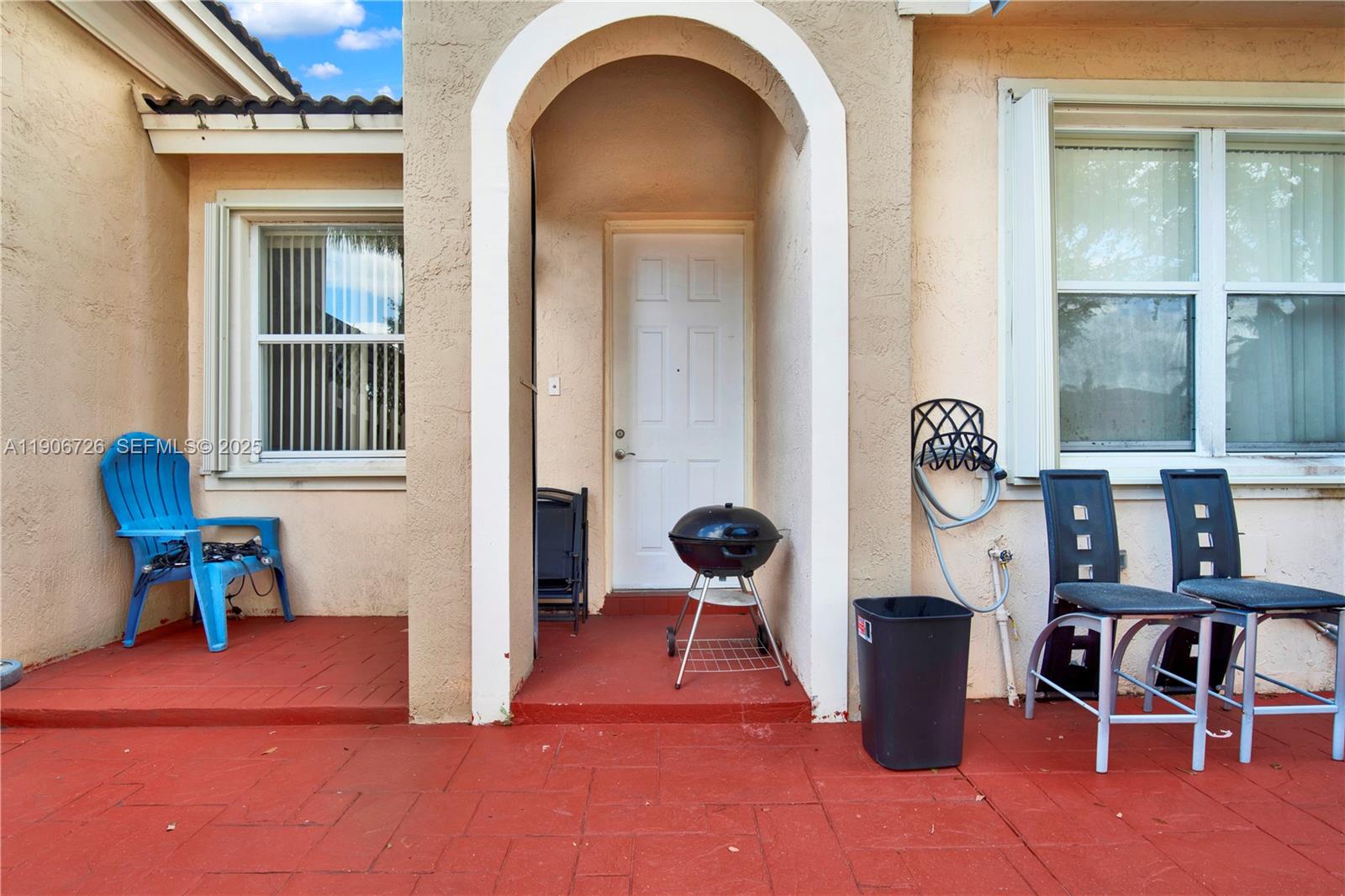 10973 Southwest 238th Street Homestead, FL 33032 - Photo 23 of 25 a front view of a house with sitting area