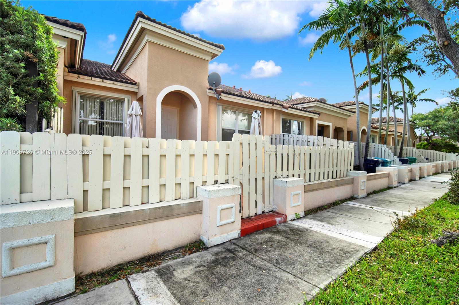 10973 Southwest 238th Street Homestead, FL 33032 - Photo 24 of 25 a front view of a house with a garden
