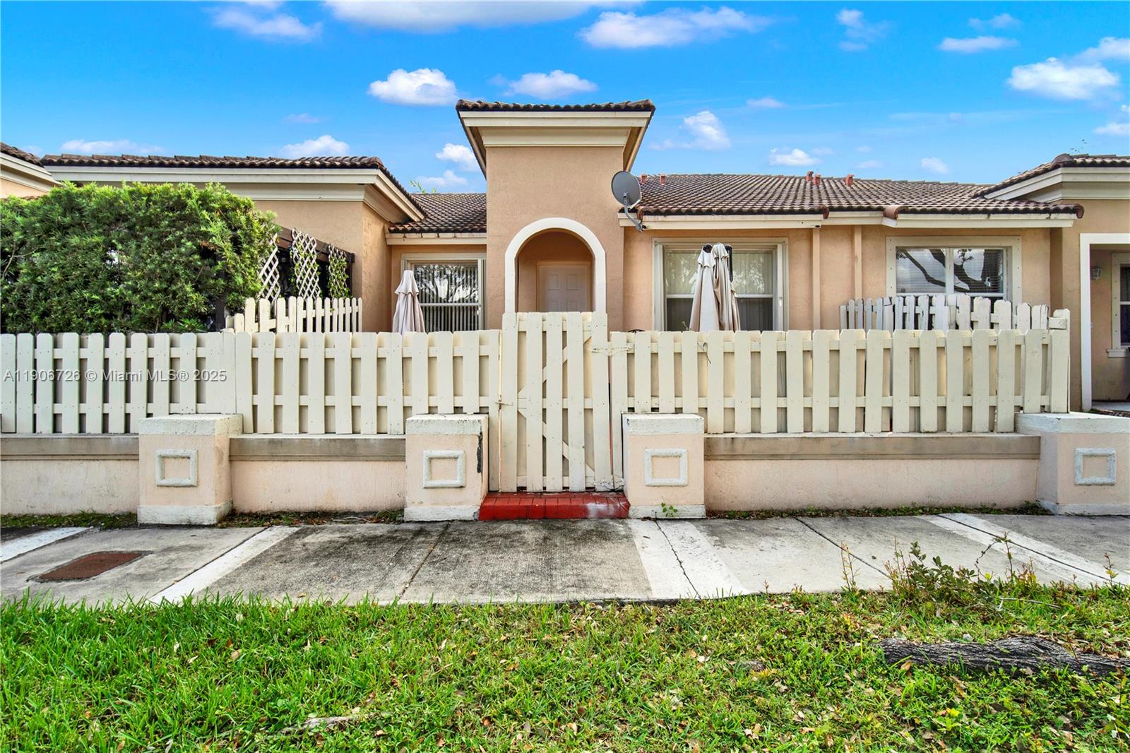 10973 Southwest 238th Street Homestead, FL 33032 - Photo 25 of 25 a front view of a house with a yard