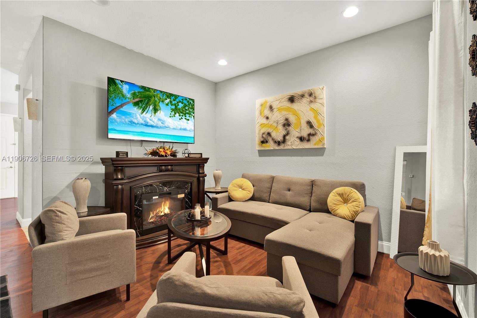 10973 Southwest 238th Street Homestead, FL 33032 - Photo 3 of 25 a living room with furniture and a flat screen tv