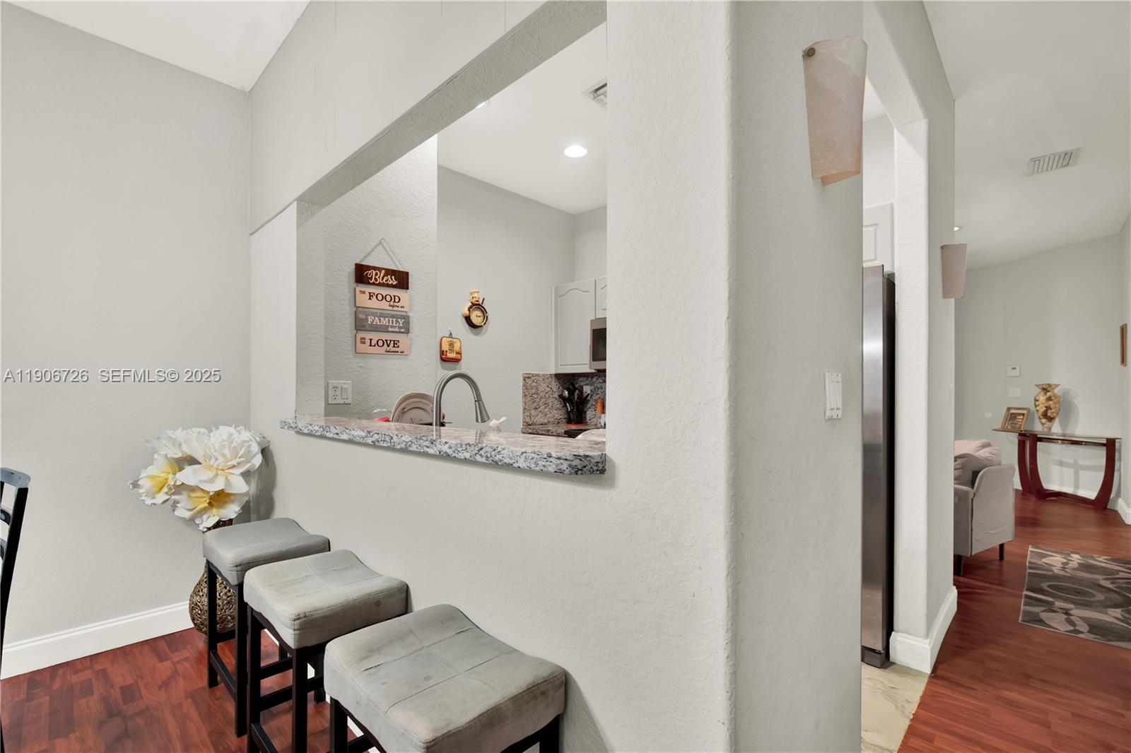 10973 Southwest 238th Street Homestead, FL 33032 - Photo 7 of 25 a dining room with furniture and wooden floor