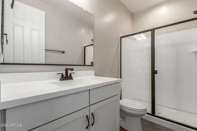 a living room with furniture a bed and a window