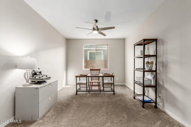 a view of a workspace with furniture