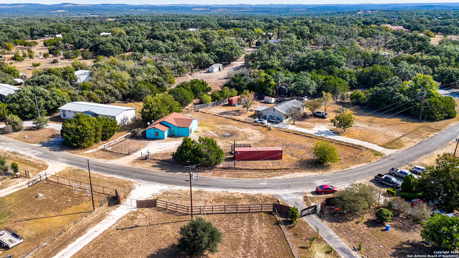 331 Rangeland Road Blanco, TX 78606 - Photo 16 of 49 a view of a swimming pool with a patio