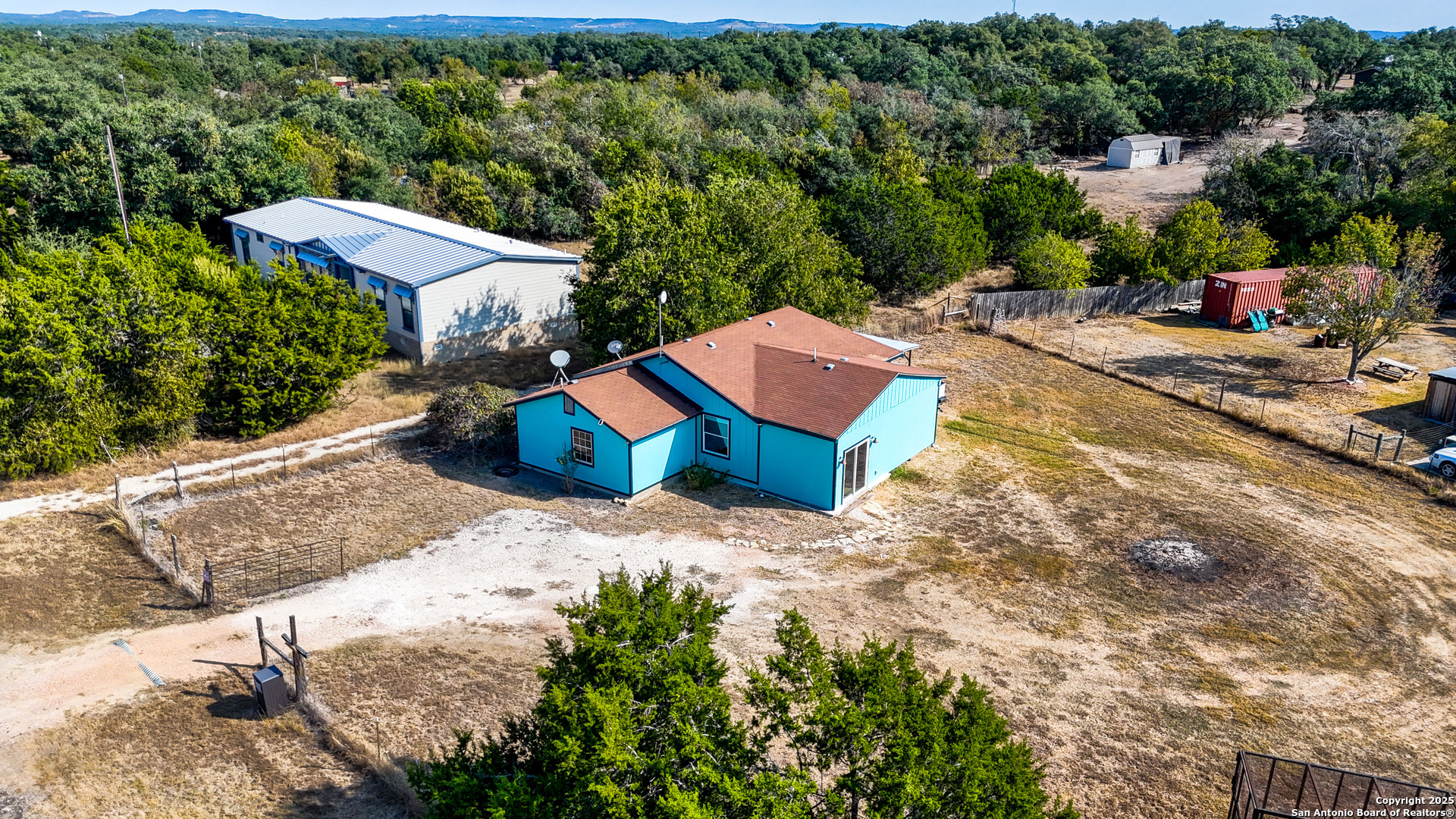 331 Rangeland Road Blanco, TX 78606 - Photo 2 of 49 a view of a swimming pool with a lounge chairs