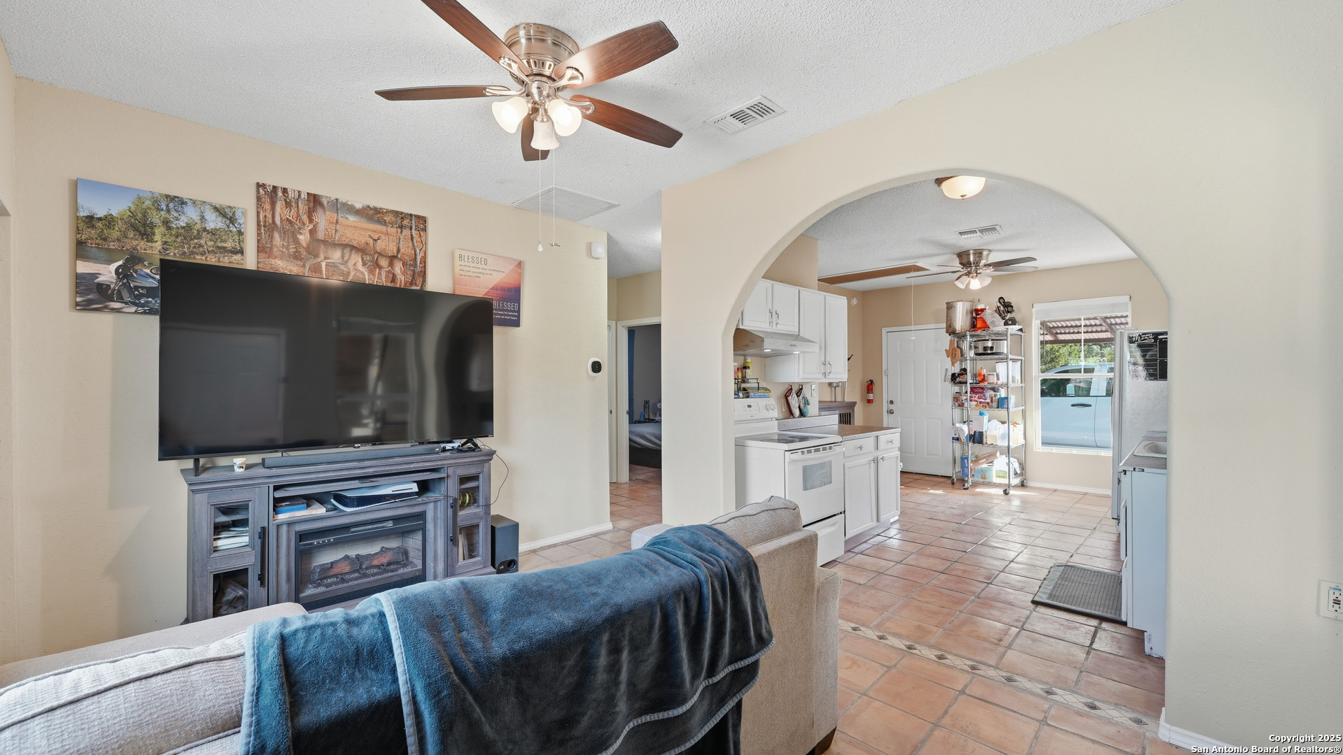 331 Rangeland Road Blanco, TX 78606 - Photo 23 of 49 a living room with furniture and a flat screen tv