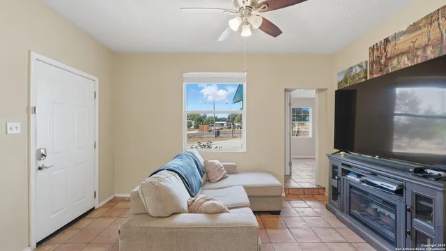 a living room with furniture and a window