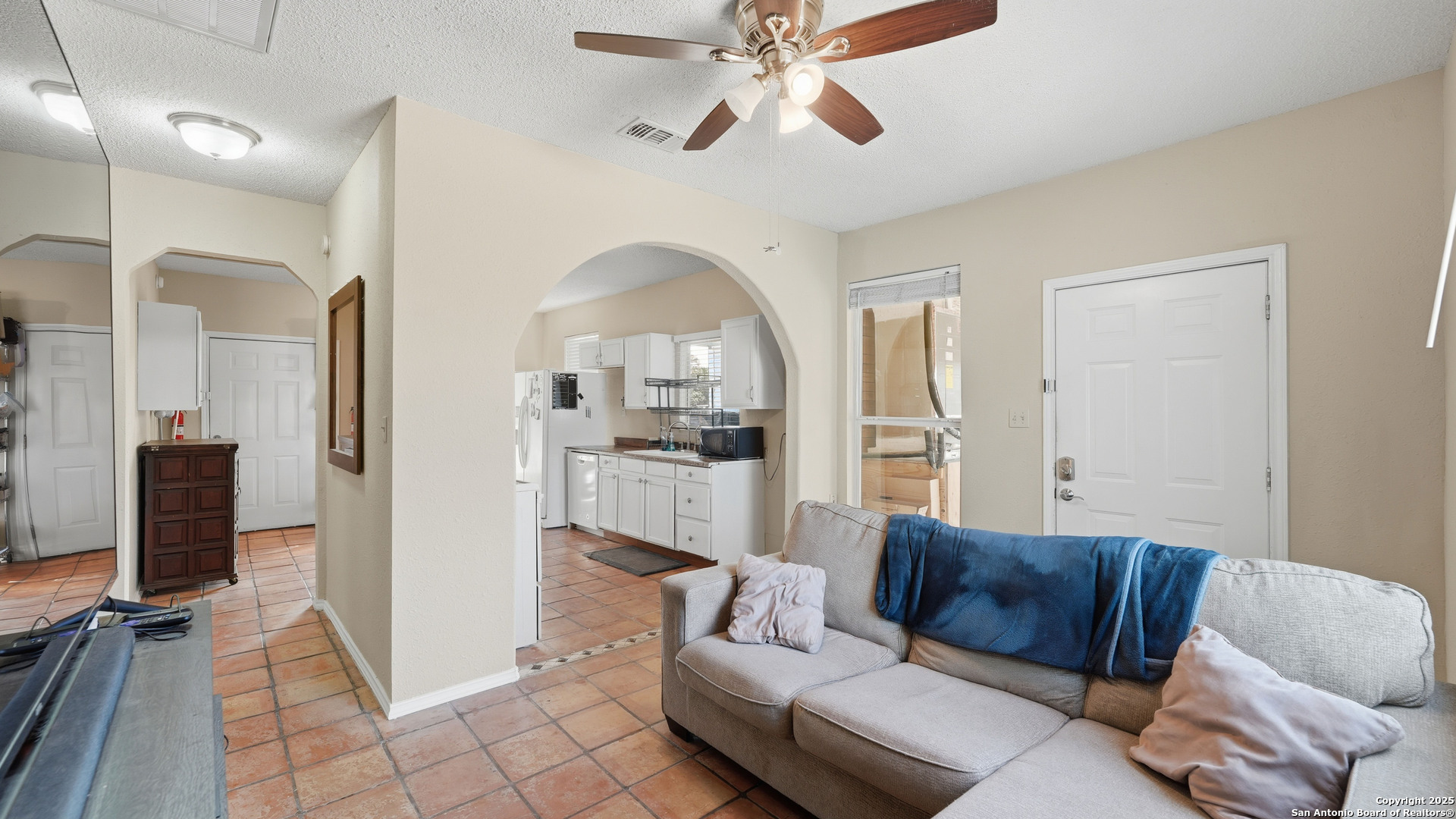 331 Rangeland Road Blanco, TX 78606 - Photo 26 of 49 a living room with furniture and a flat screen tv