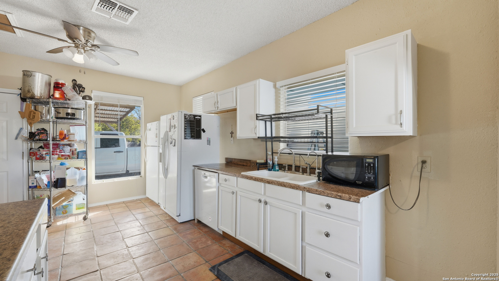 331 Rangeland Road Blanco, TX 78606 - Photo 29 of 49 a kitchen with a refrigerator and a sink